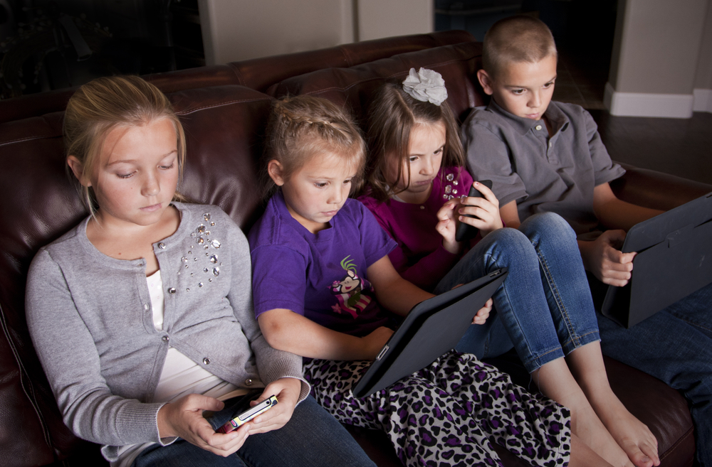 family playing games on mobile devices