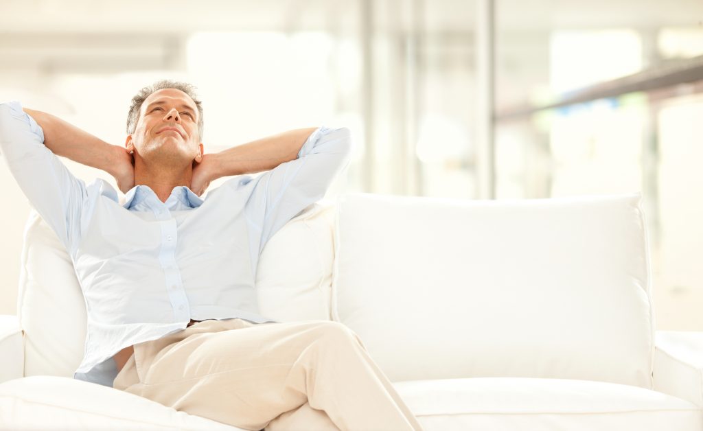 man relaxing on his couch after therapy session
