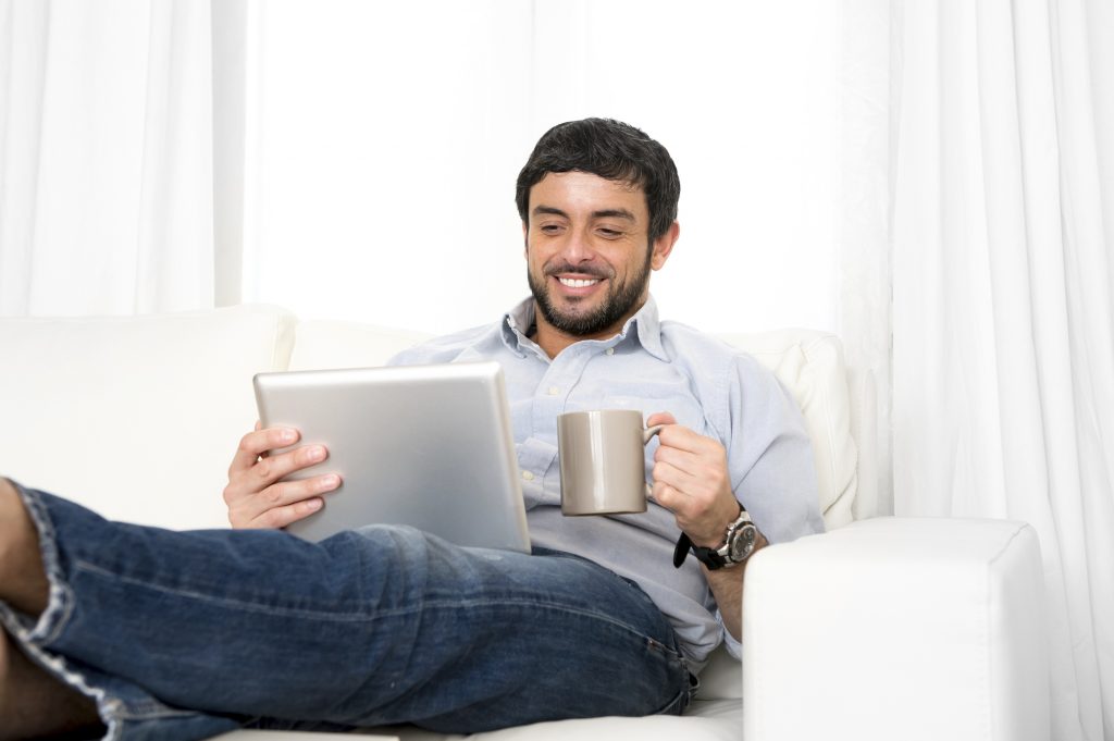 man participating in online psychiatry sesson from home